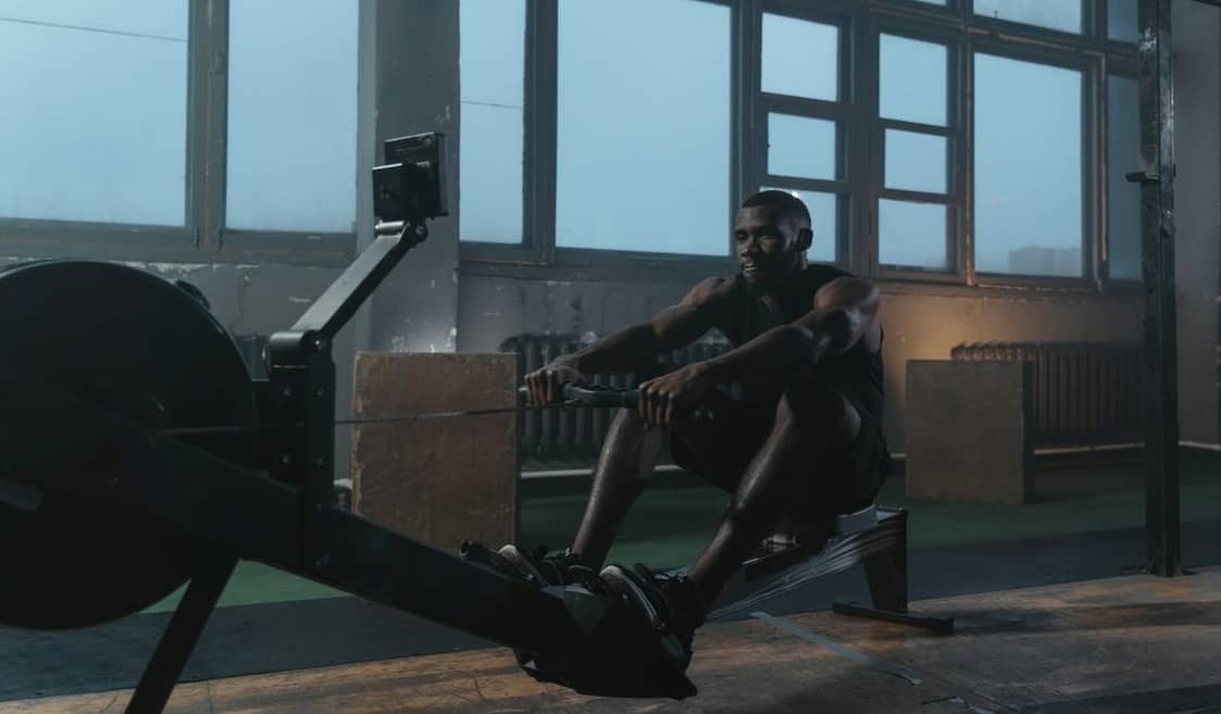 Man working out on a rowing machine