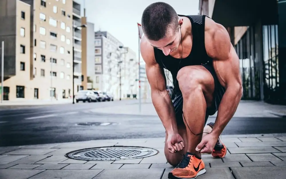 Runner tying his shoelaces